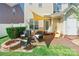 Cozy patio features seating, a fire pit, and an awning for shade at 16431 Leavitt Ln, Davidson, NC 28036