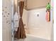 Clean bathroom with a shower-tub combination and neutral walls at 16431 Leavitt Ln, Davidson, NC 28036
