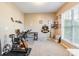 Versatile home office space with ample natural light and carpeted floors at 16431 Leavitt Ln, Davidson, NC 28036