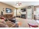 Inviting living room with stone fireplace, modern lighting, and cozy seating at 16431 Leavitt Ln, Davidson, NC 28036