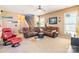 Comfortable living room with plush sectional, accent chair, and abundant light at 16431 Leavitt Ln, Davidson, NC 28036