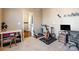 Spacious workout room with various exercise equipment and neutral tones at 16431 Leavitt Ln, Davidson, NC 28036