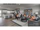 Stylish living room featuring modern decor, comfortable seating, and an open floor plan that connects to the kitchen at 169 Basildon St # 1012, Lancaster, SC 29720