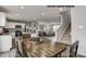 Open-concept living space showcasing a modern kitchen, dining area, and inviting living room with staircase access at 169 Basildon St # 1012, Lancaster, SC 29720