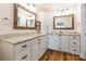 This bathroom has double sinks, granite countertops, and wood laminate flooring at 1720 Gaither Rd, Belmont, NC 28012