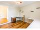 Bedroom featuring wood floors, a ceiling fan, white trim, and built in desk at 1720 Gaither Rd, Belmont, NC 28012