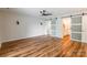 This bedroom has laminate wood floors, ceiling fan, and a sliding glass door to the main bath at 1720 Gaither Rd, Belmont, NC 28012