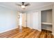 This bedroom has laminate wood floors, ceiling fan, and a double door closet at 1720 Gaither Rd, Belmont, NC 28012