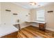 This bedroom has laminate wood floors, ceiling fan, and two built in desks at 1720 Gaither Rd, Belmont, NC 28012