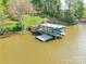 View of a private dock on the lake perfect for boating and enjoying the water at 1720 Gaither Rd, Belmont, NC 28012