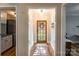 Entryway with a wooden door, hardwood floors and a glimpse into other rooms at 1720 Gaither Rd, Belmont, NC 28012