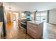 Modern kitchen features granite countertops, wood cabinets, tile floors, and lake views at 1720 Gaither Rd, Belmont, NC 28012