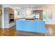 Kitchen island featuring light blue paneling, granite countertop and tile flooring at 1720 Gaither Rd, Belmont, NC 28012