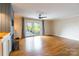 Spacious living room featuring hardwood floors, fireplace, and sliding door to deck at 1720 Gaither Rd, Belmont, NC 28012