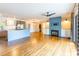 Open concept living room with blue center island, hardwood floors, and fireplace at 1720 Gaither Rd, Belmont, NC 28012