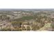 Aerial view of the property shows the home and land nestled amongst mature trees at 174 Maske Rd, Mount Gilead, NC 27306