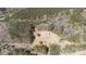 Aerial view of the home and its acreage surrounded by lush trees and nature at 174 Maske Rd, Mount Gilead, NC 27306