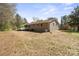 Side of the home featuring a ramp and an exterior of grey brick at 174 Maske Rd, Mount Gilead, NC 27306