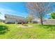 Large backyard view featuring a deck, fire pit and hammock, perfect for outdoor activities at 1805 Lawton Dr, Rock Hill, SC 29730