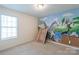 Bedroom with window, neutral walls, and a whimsical animal-themed wall mural at 1805 Lawton Dr, Rock Hill, SC 29730