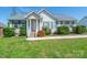 Charming single-story home featuring a welcoming front porch and well-maintained landscaping with lush shrubs at 1805 Lawton Dr, Rock Hill, SC 29730