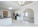 Bright kitchen featuring stainless steel appliances, white cabinets, and a view to living area with open floor plan at 1805 Lawton Dr, Rock Hill, SC 29730