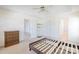 Sun-filled main bedroom with an empty bed frame, dresser, and doors to the bathroom and other rooms at 1805 Lawton Dr, Rock Hill, SC 29730