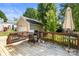 Back deck with a grill, table, and umbrella, perfect for backyard barbecues at 18838 Oakhurst Blvd, Cornelius, NC 28031