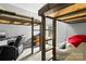 Spacious bedroom featuring custom bunk beds, a desk, and a comfortable beanbag chair at 18838 Oakhurst Blvd, Cornelius, NC 28031