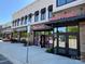 Retail space with multiple businesses, showcasing storefronts with awnings, signage and pedestrian access at 18838 Oakhurst Blvd, Cornelius, NC 28031