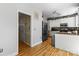 Open kitchen area featuring white cabinets and stainless steel appliances at 18838 Oakhurst Blvd, Cornelius, NC 28031