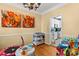 Bright playroom with colorful artwork, a changing table, and easy access to kitchen at 18838 Oakhurst Blvd, Cornelius, NC 28031