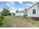 Backyard view of property showcasing the detached garage and additional storage shed at 1926 Coley Sw St, Concord, NC 28027