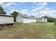 Expansive backyard with garage, storage shed and fire pit, perfect for outdoor gatherings and activities at 1926 Coley Sw St, Concord, NC 28027