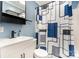 Bathroom featuring a modern vanity with black hardware and blue and gray shower curtain at 1926 Coley Sw St, Concord, NC 28027