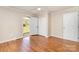This bedroom features hardwood floors and exterior access to the backyard at 1926 Coley Sw St, Concord, NC 28027