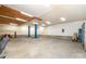A spacious garage featuring an automotive lift, ample room for vehicles and storage at 1926 Coley Sw St, Concord, NC 28027
