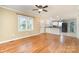 Open concept living area showcasing hardwood floors, connecting to the updated kitchen with bar seating at 1926 Coley Sw St, Concord, NC 28027