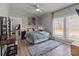 Bright bedroom with a ceiling fan, large windows, and a soothing color palette at 207 Kerr Nw St, Concord, NC 28025