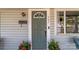Close-up of a stylish front door, potted plants and a clear view of the house number at 207 Kerr Nw St, Concord, NC 28025