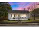 Charming single-story home with a welcoming front porch, perfect for relaxing and enjoying the neighborhood at 207 Kerr Nw St, Concord, NC 28025