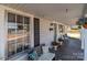 Cozy front porch with comfortable seating, decorative plants, and an inviting view of the neighborhood at 207 Kerr Nw St, Concord, NC 28025