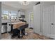 Modern kitchen with tile backsplash, movable island, and a door to outside at 207 Kerr Nw St, Concord, NC 28025