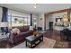 Comfortable living area with hardwood floors, a stylish sofa, and a view into a separate office space at 207 Kerr Nw St, Concord, NC 28025