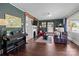 Inviting living room with a fireplace, hardwood floors, and a large window offering ample natural light at 207 Kerr Nw St, Concord, NC 28025