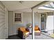 Covered porch featuring two chairs and a small table at 207 Kerr Nw St, Concord, NC 28025