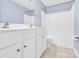 Bright bathroom featuring a double sink vanity and combined tub and shower at 2125 Arbor Vista Dr, Charlotte, NC 28262