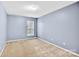 Bedroom featuring neutral walls and a large window at 2125 Arbor Vista Dr, Charlotte, NC 28262