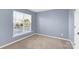 Cozy bedroom featuring a large window providing natural light at 2125 Arbor Vista Dr, Charlotte, NC 28262