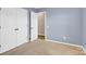 Comfortable bedroom with carpet floors and a double-door closet for ample storage at 2125 Arbor Vista Dr, Charlotte, NC 28262